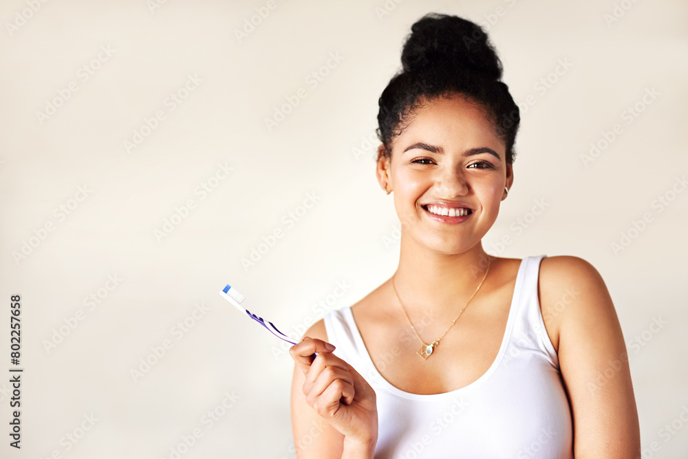 Smile, oral health and portrait of woman with toothbrush for morning hygiene routine in studio. Happy, clean and person with dental care product for plaque, gums and breath by white background mockup Smile, oral health and portrait of woman with toothbrush for morning hygiene routine in studio. Happy, clean and person with dental care product for plaque, gums and breath by white background mockup