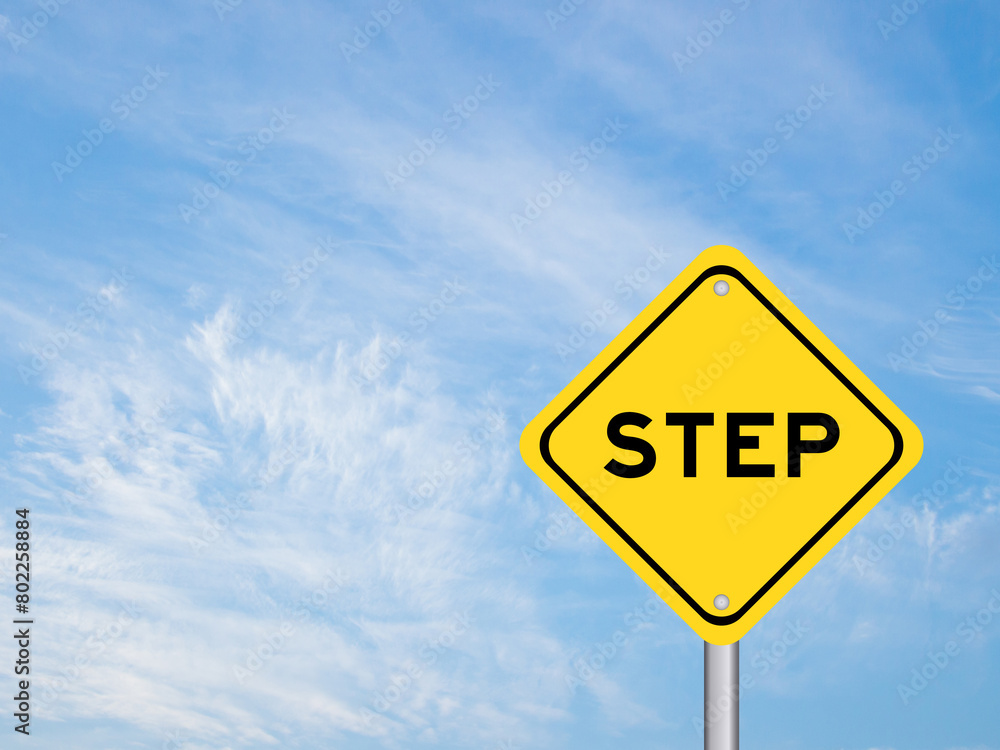 Yellow transportation sign with word step on blue color sky background Yellow transportation sign with word step on blue color sky background