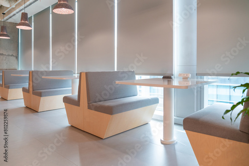 Interior of modern empty office building.Open ceiling design.Equipped with automatic lifting table and LCD screen.