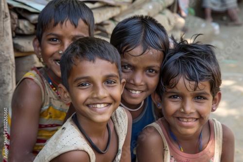 Group of indian kids smiling and looking at camera in the village