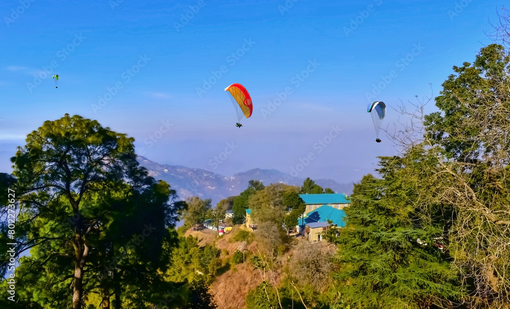Beautiful landscape view with Paragliders in the sky at Bir Billing Himachal Pradesh. Beautiful landscape view with Paragliders in the sky at Bir Billing Himachal Pradesh.