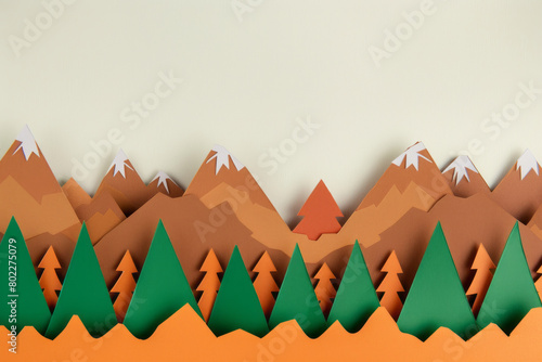 Colorful paper cutout mountain and forest landscape