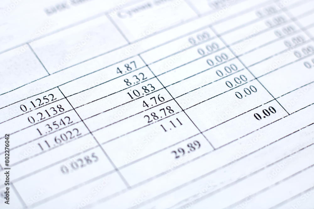 Close up of electric blue numbers on a paper document with font pattern Close up of electric blue numbers on a paper document with font pattern