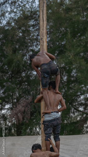 Panjat Pinang is one of the competitions to commemorate the independence of the Republic of Indonesia photo