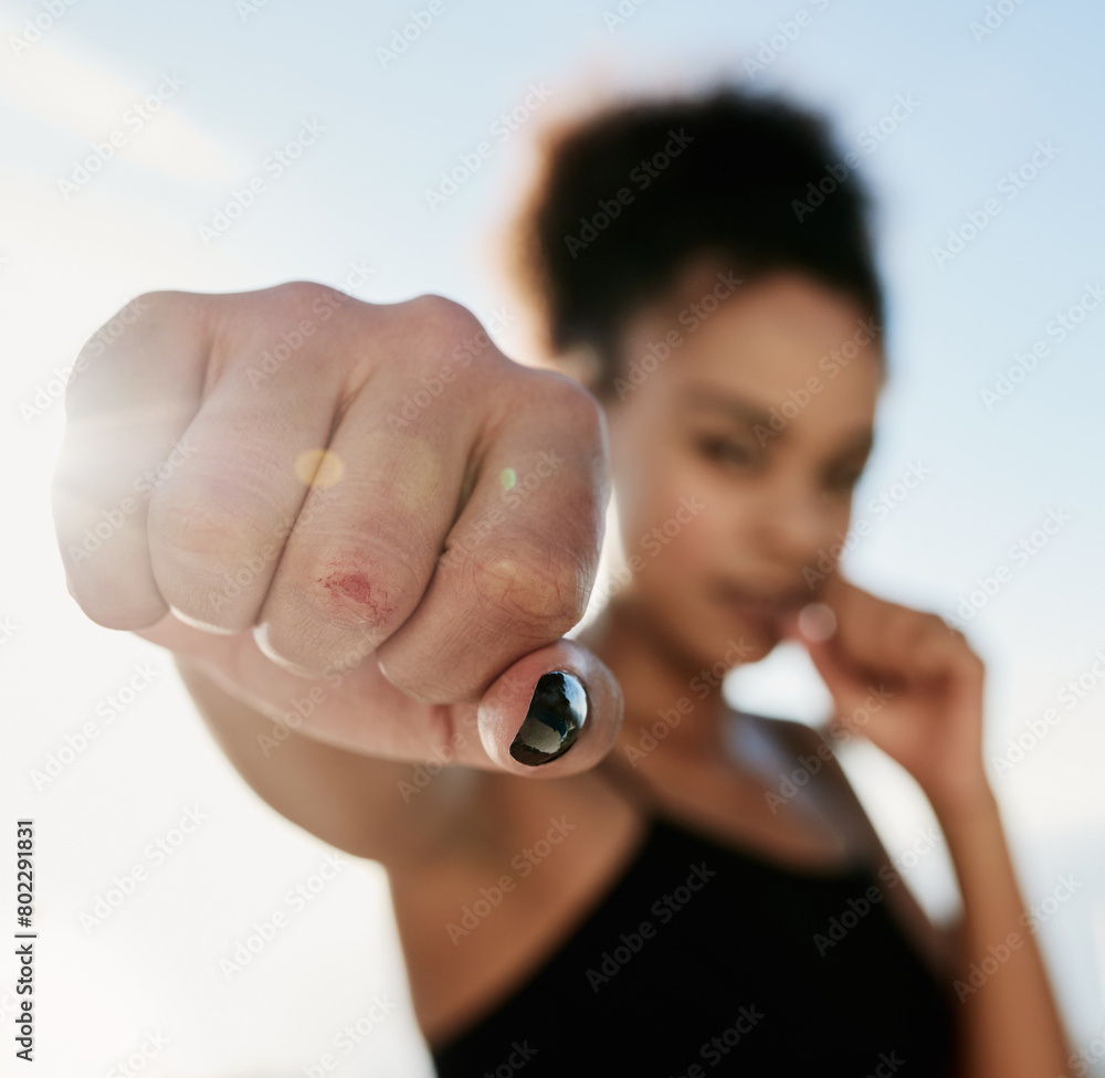 Fototapeta premium Black woman, boxer and hand to punch for fitness in outdoor for workout or training with health or wellness as fighter. Active, female person and exercise with fist for speed as warrior by house