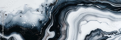 a fluid, organic mix of black and white resembling marble or a geological formation, with dynamic swirls and intricate details photo
