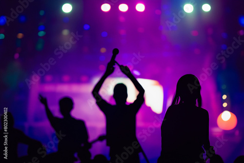 Concert. Festival rock together singing people group unrecognizable musicians silhouettes stage concert playing band music silhouette light song.