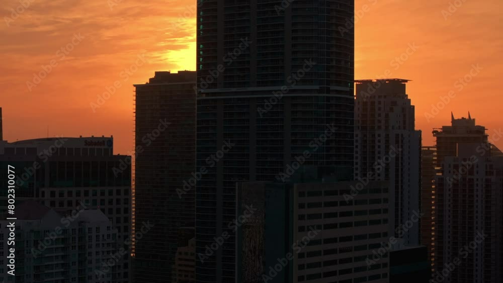 Establishing aerial view of Miami Brickell downtown skyline at golden hour. Aerial close up view of Miami modern skyscraper, hotels and residential buildings on a beautiful golden sunset Establishing aerial view of Miami Brickell downtown skyline at golden hour. Aerial close up view of Miami modern skyscraper, hotels and residential buildings on a beautiful golden sunset