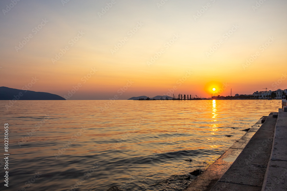 A picturesque landscape overlooking the sea in the evening during sunset