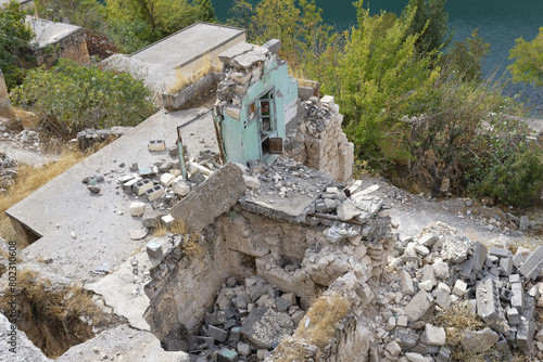 Abandoned houses in Eski Savasan after the construction of the Birecik dam on the Euphrates River, Halfeti, Turkey photo