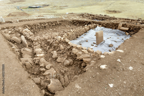 Neolithic archaeological site of Karahan Tepe, Circular stone structure with T Shape pillars, Sanliurfa, Turkey photo