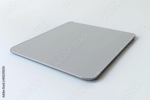 A 3D render of a sleek trackpad with a hitech, touchsensitive surface and clean lines, isolated on white background photo