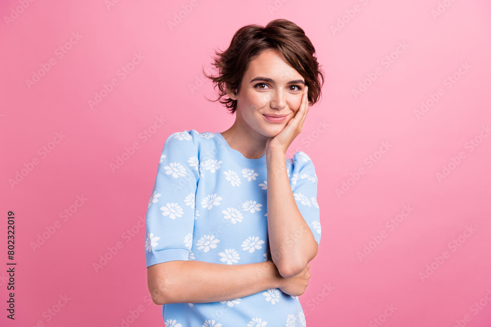 Photo of satisfied glad nice young lady arm touch cheek wear short sleeve sweater isolated on pink color background Photo of satisfied glad nice young lady arm touch cheek wear short sleeve sweater isolated on pink color background