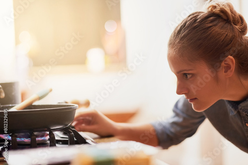 Bild auf Leinwand Cooking, home and woman light gas stove in kitchen for healthy diet, nutrition and meal prep for eating food