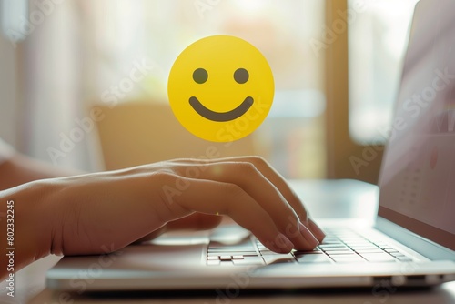 Smiling emoji symbolizing job satisfaction and happiness in modern office setting during the workday. photo