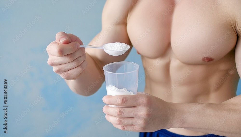 A bodybuilder showing the creatine powder sports food supplement.
A bodybuilder showing the creatine powder sports food supplement.