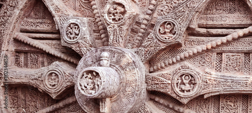 10 March, 2024, Sun Temple, Konark, Orissa India, Ruins of 800 year old temple dedicated to Sun. Close up of upper side of a wheel. All 24 wheels are sundials to measure movement of sun and planets photo