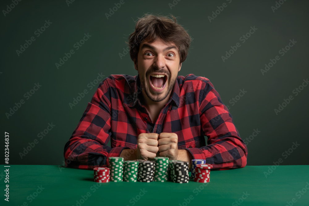 Excited man with poker chips at table Excited man with poker chips at table