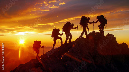Team of people walking to the top of a mountain. 