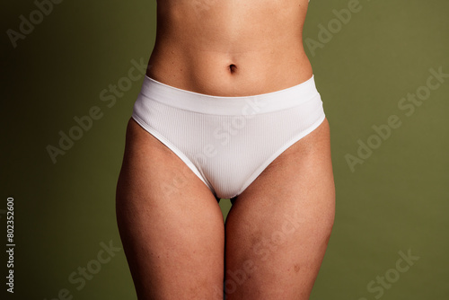 No retouch cropped photo of lady underwear lingerie accepting herself isolated green color background