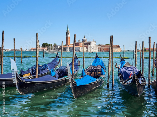 Gondolas and the San Giorgio Maggiore Basilica and island seen from Riva degli Schiavoni promenade. Venetian Lagoon, Venice, Italy, Europe