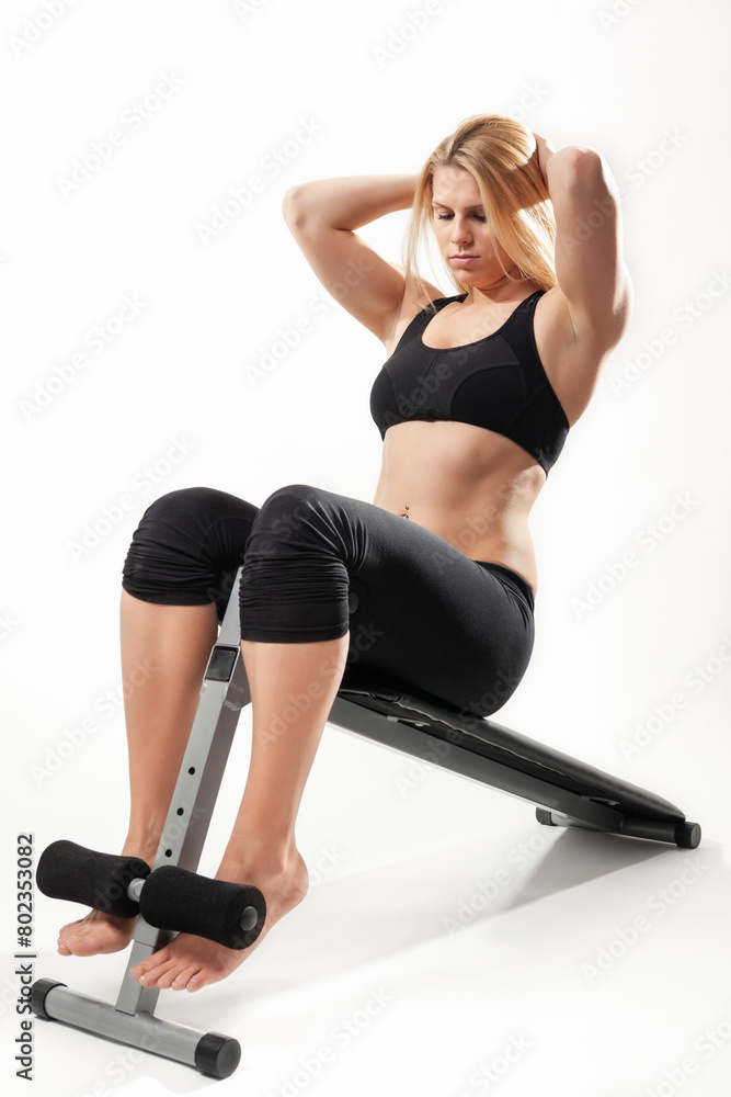 Beautiful blond woman athlete doing sit ups Beautiful blond woman athlete doing sit ups