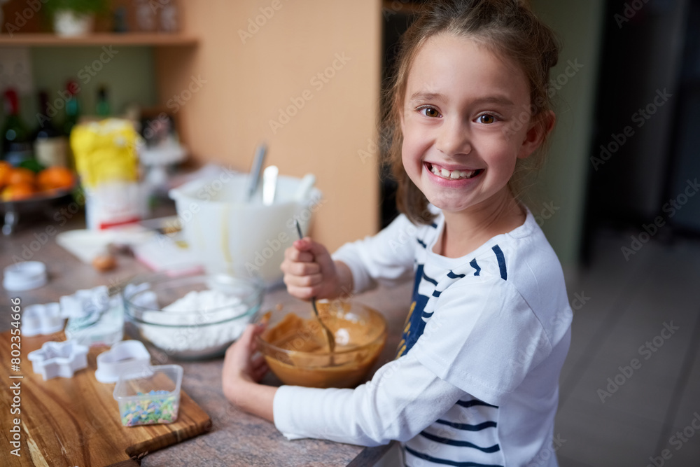 Happy girl, portrait and baking with bowl of dessert for cupcake mixture, caramel or cooking at home. Little child, kid or baker mixing sweet ingredients or food for cookies, delicious treat or meal
