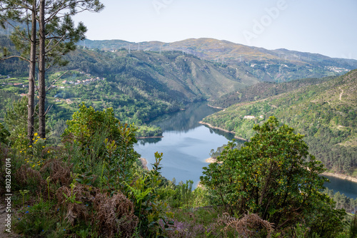 Landscape view on dammed Cávado river reservoir and village Frades, municipality of Vieira do Minho, district of Braga, Portugal photo