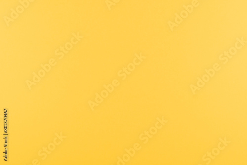 Fond uni pour création d'arrière plan de couleur jaune soleil. photo