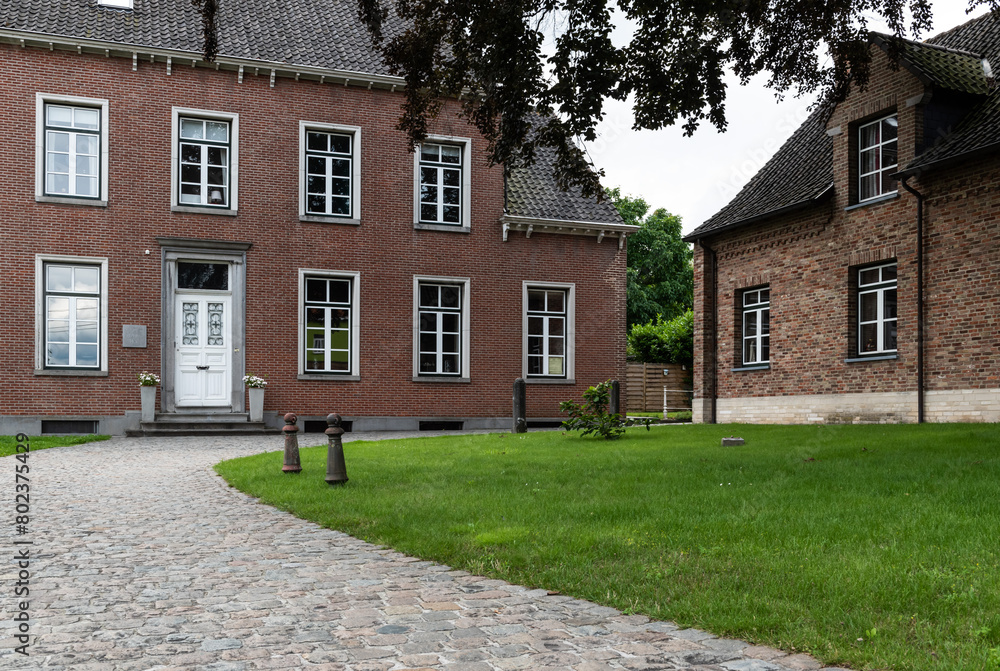 Sint Blasius Boekel, Zwalm, Belgium - Parsonage house in traditional brick stone with front garden Sint Blasius Boekel, Zwalm, Belgium - Parsonage house in traditional brick stone with front garden