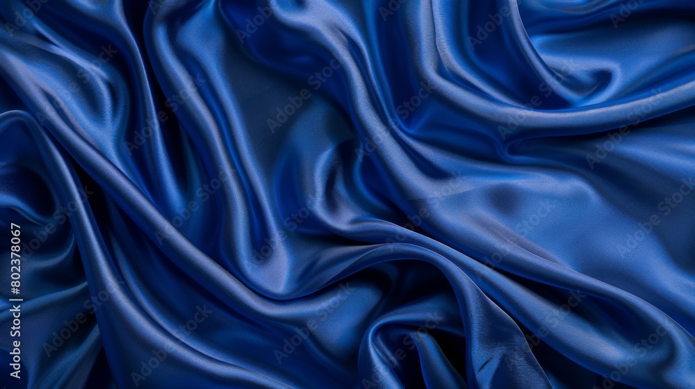 Silky satin fabric in a royal blue shade brings a smooth and luxurious texture to your background. Silky satin fabric in a royal blue shade brings a smooth and luxurious texture to your background.