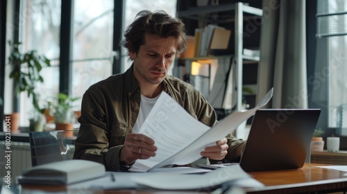 Man Concentrating on Paperwork