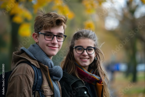 Teenage friends smiling in autumn, vibrant fall colors background, educational or lifestyle themes.