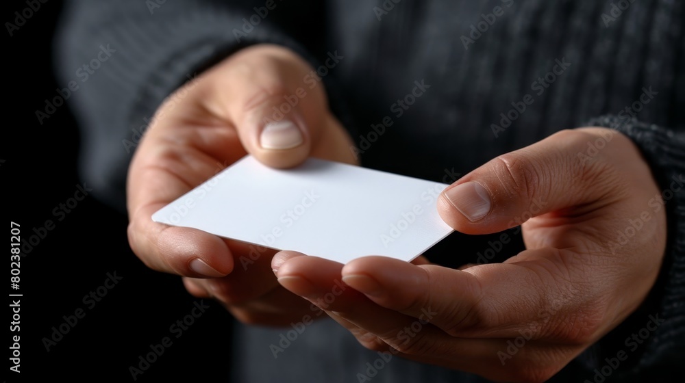 Obraz premium A6 flyer postcard invitation mockup - male hands holding blank flyer on gray background