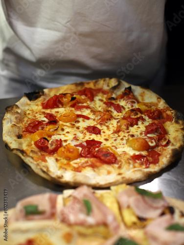 freshly baked artisanal mozzarella and tomato pizza