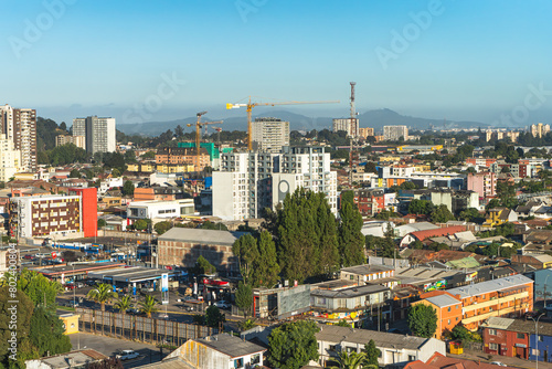 Downtown in Concepcion, Chile. This is an aerial view of the center of the city in the morning with an open blue sky 