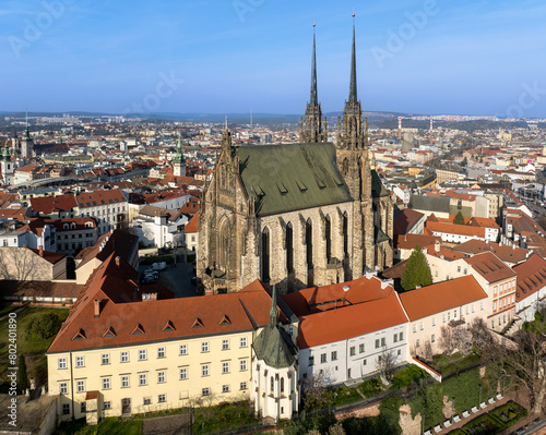 Brno, Czechia. Active Roman Catholic cathedral of St. Peter and Paul. Originally medieval in gothic style, then many renovations, High towers added in Gothic revival between 1901-1909. Aerial view