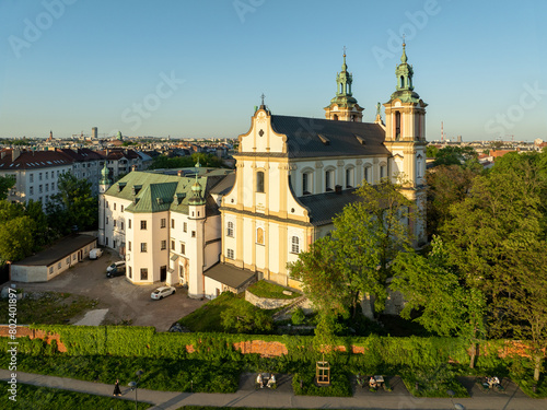 Skalka. St. Stanislaus church and Paulinite monastery in Krakow, Poland. Historic burial place of distinguished Poles. Aerial view. Spring, sunset light. Promenade along the wall with climbing vine