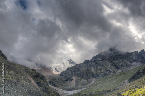 Low dark clouds float over the mountains.