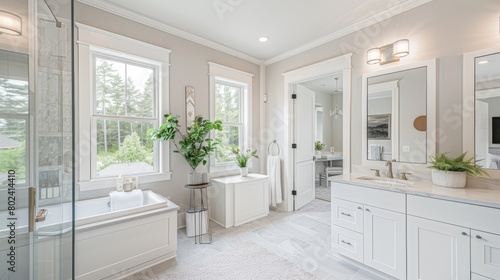 a large  elegant bathroom boasting an open layout adorned with two white cabinets and a double vanity  exuding sophistication through clean lines and bathed in natural light