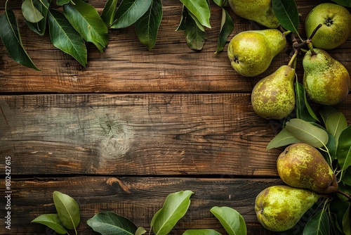 Green pears with leafs on wooden table