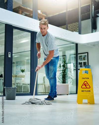Man, mopping and business office or cleaning hygiene with caution sign or water, soap or bacteria. Male person, janitor and wash service in corporate building at dirty floor or labor, health or germs