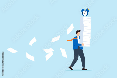 Businessman carrying heavy documents and paperwork, with alarm clock deadline atop pile. Concept of workload, overworked office routine, aggressive deadlines leading to exhaustion and burnout