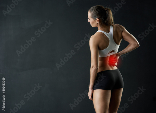 Back pain, stress or girl in studio with fitness mockup, mistake or red glow anatomy, risk or emergency on black background. Gym, injury or athlete with backache, tension or burnout and fibromyalgia