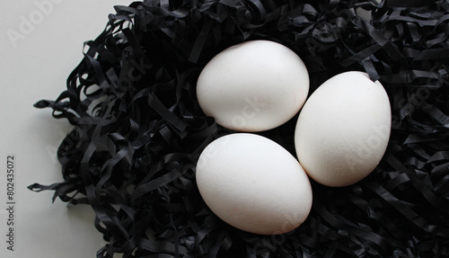 Shavings Nest With Three Clean White Chicken Eggs On Clean White Surface 