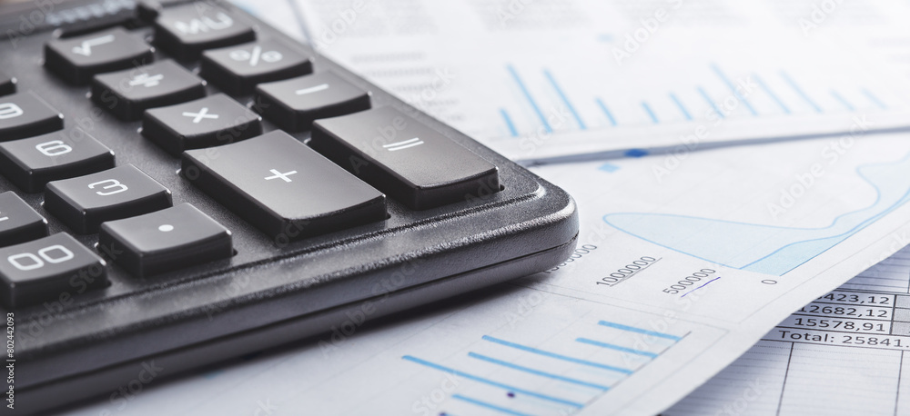 calculator and financial charts. Investment and capital accumulation concept calculator and financial charts. Investment and capital accumulation concept