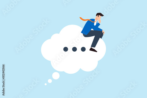 Businessman sits on thinking bubble, deep in thought like the thinker statue. Concept of considering solutions, critical thinking to solve problems and focusing on new ideas