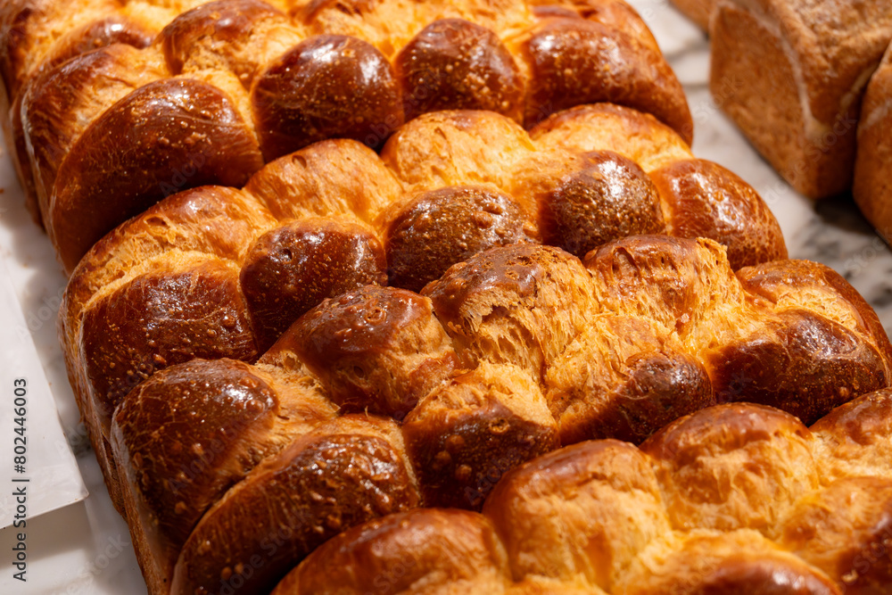 Traditional Jewish bread challah braided brioche bread in bakery