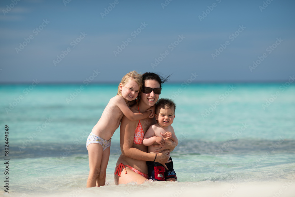 mother with children, playing with kids, family on the beach, swimming in the ocean, vacations in warm countries, Caribbean sea, Atlantic ocean, Cuba, summer vacation, summer weekend, maternity leave mother with children, playing with kids, family on the beach, swimming in the ocean, vacations in warm countries, Caribbean sea, Atlantic ocean, Cuba, summer vacation, summer weekend, maternity leave
