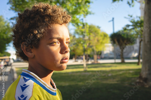 Portrait of a boy posing. African American boy. Model child. Afro hair. Happiness. Smiling